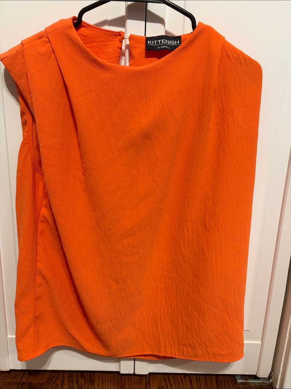 Kittenish Vibrant Orange Sleeveless Blouse